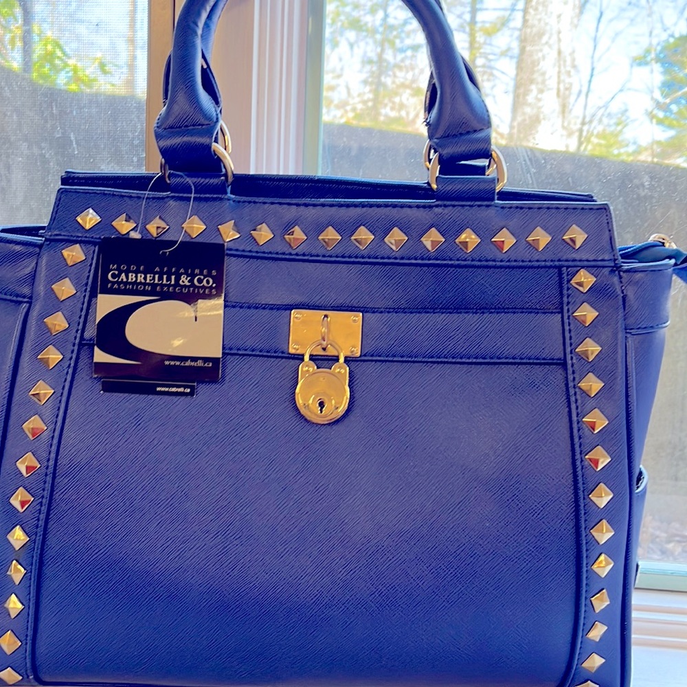 Cabrelli &Co clutch bag. Studded with decorative lock.